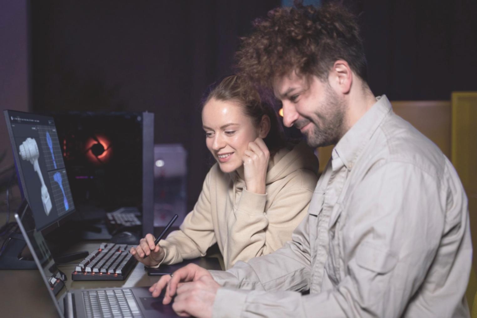 Developer working on code optimization with multiple monitors showing performance metrics